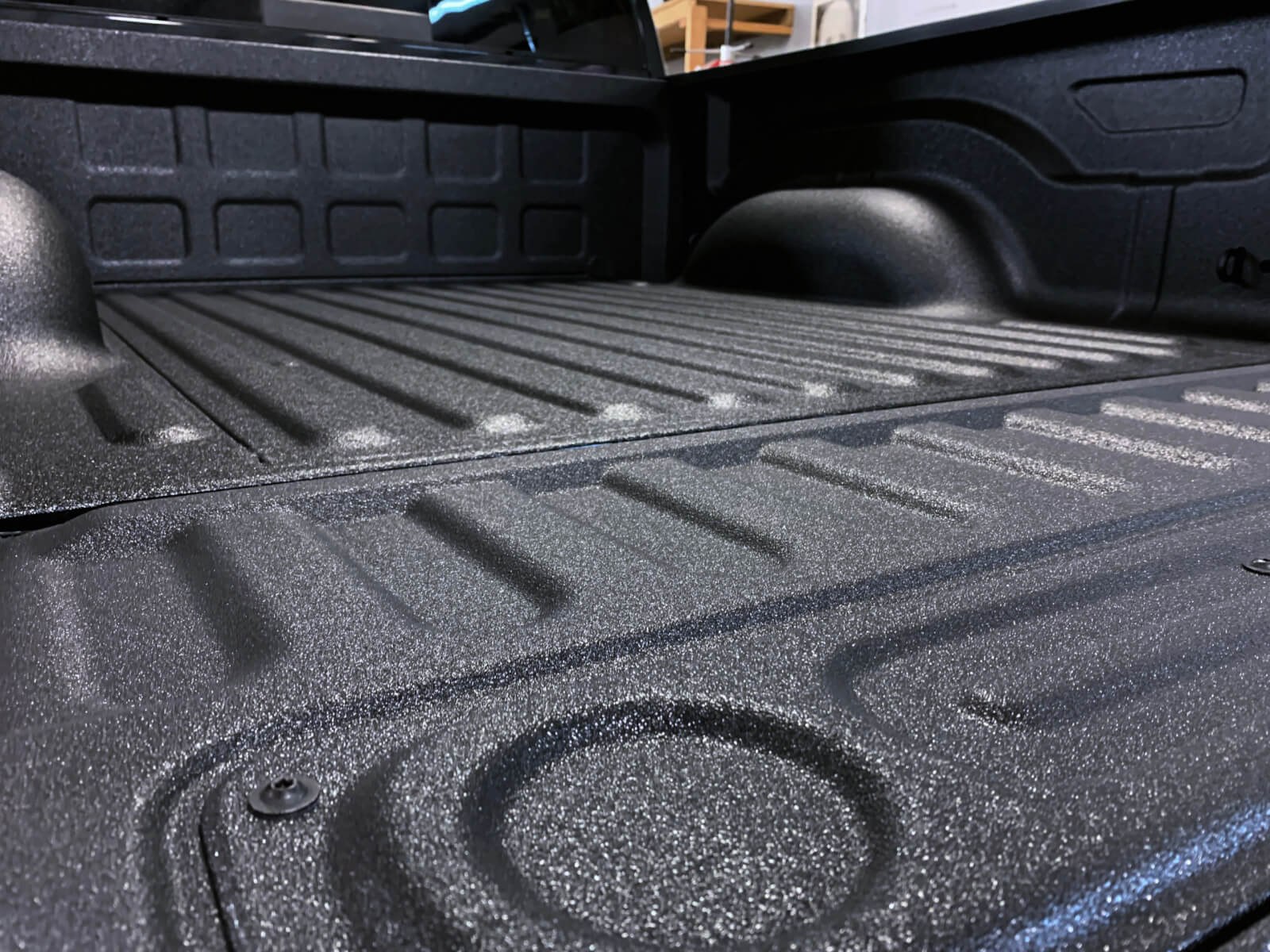 Spray-in bed liner on a truck bed